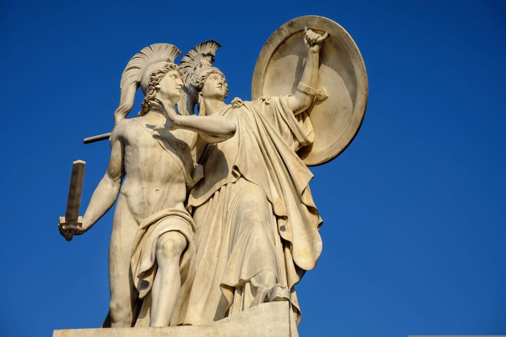 A classical marble statue of two armored figures, symbolizing the strength and guidance needed for parenting with boundaries.