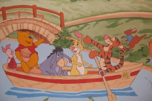 Eeyore drifting in a rowboat with friends, illustrating how to stop intrusive thoughts by dropping the struggle
