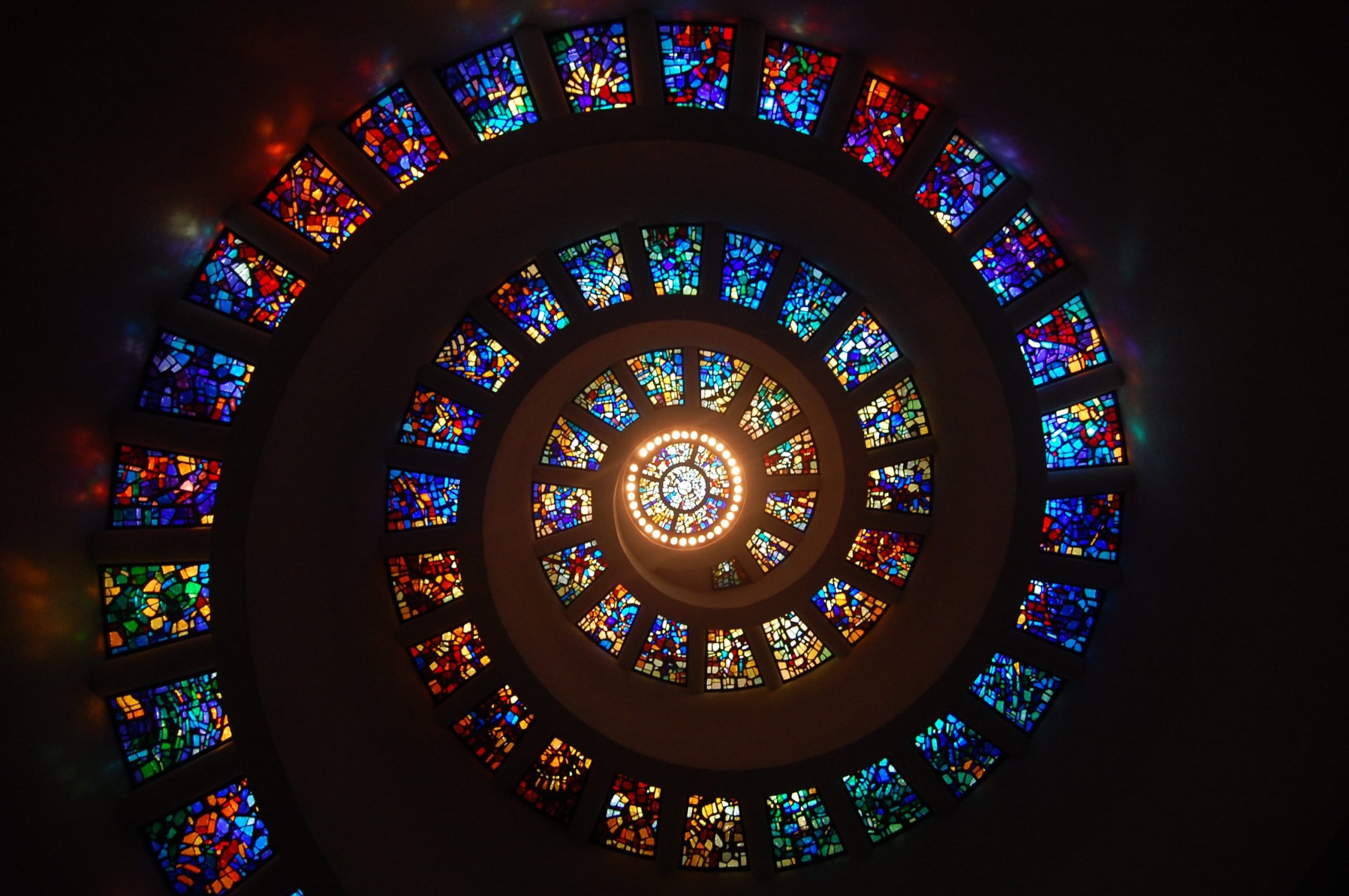 Spiral of stained glass panels illustrating the fragmented identity of borderline personality disorder